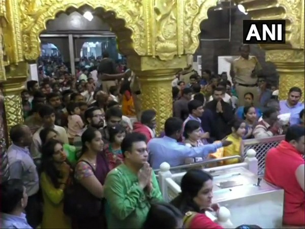 Devotees visiting Sai Baba temple in huge numbers on Sunday (Photo/ANI)