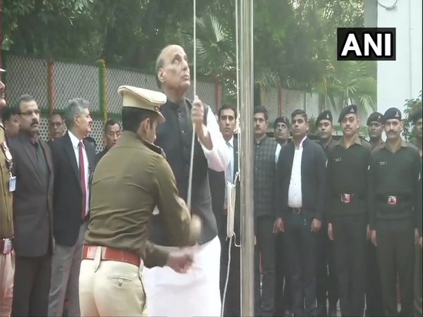 Union Defence Minister Rajnath Singh hoists the national flag at his residence.