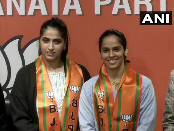 Ace Indian shuttler Saina Nehwal along with her elder sister Abu Chandranshu Nehwal while joining BJP on Wednesday. (Photo/ANI)