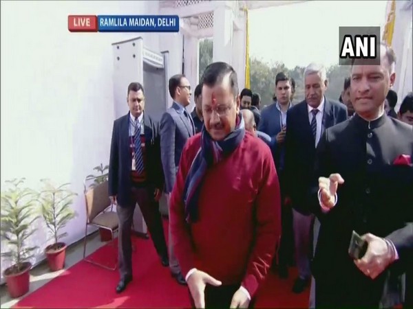Delhi Chief Minister-designate Arvind Kejriwal arrives at Ramlila Maidan for the swearing-in ceremony on Sunday. Photo/ANI
