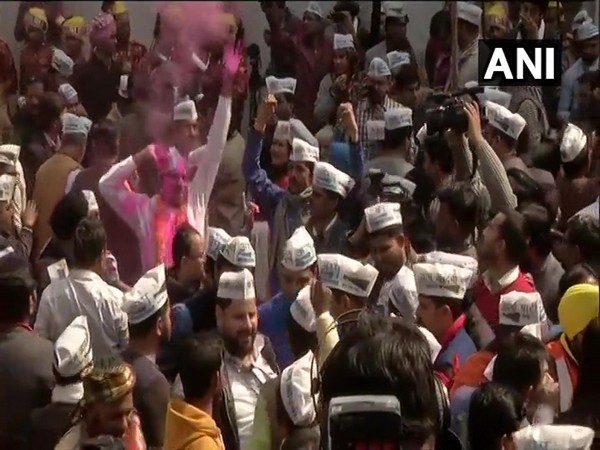 The Aam Aadmi Party workers celebrate as the party takes a big lead in Delhi polls trends. Photo/ANI