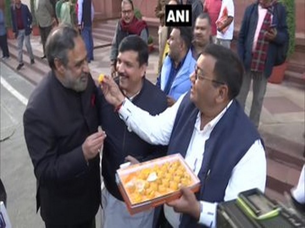 Aam Aadmi Party (AAP) MP Sushil Gupta distributed sweets in Parliament premises on Tuesday. Photo/ANI