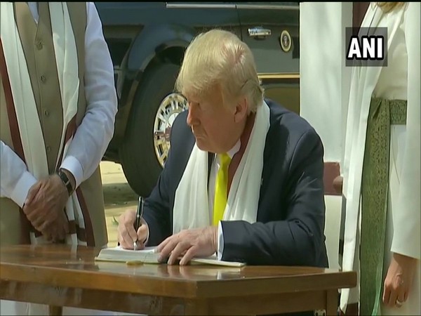 US President Donald Trump writing in visitor's book at Sabarmati Ashram