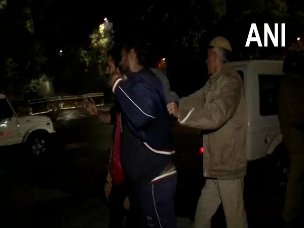A police personnel dispersing protestors who gathered outside Kejriwal's residence. Photo/ANI