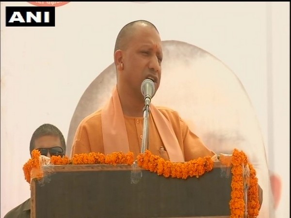 UP CM Yogi Adityanath addressing a rally in Kushinagar on Sunday. Photo/ANI