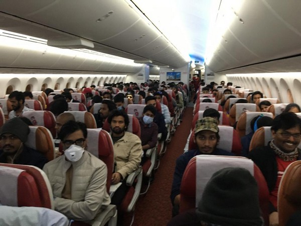 The Indian students in Air India flight which took off from Milan for India. (Photo source: Indian Embassy in Italy Twitter)