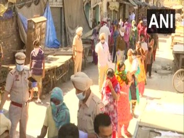 Amritsar Poice distributed food items among the needy people on Thursday (Photo/ANI)