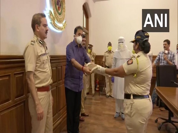 Maharashtra Home Minister Anil Deshmukh distributed Personal Protective Equipment, masks and sanitisers to Mumbai police personnel.