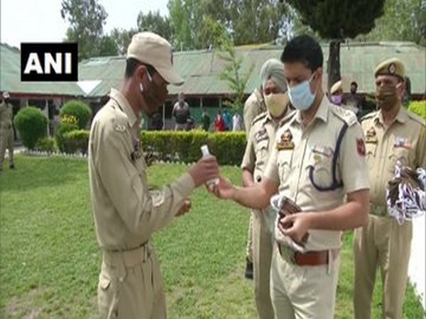 Poonch Police distributing face masks and sanitisers to personnel on Friday. Photo/ANI