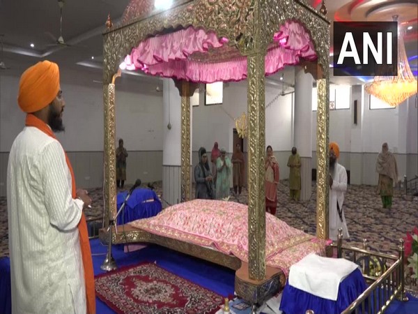 Devotees offer prayers at a gurdwara in Jammu and Kashmir on Monday.