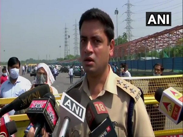 ACP Karan Goyal speaking to media persons at the Delhi-Gurugram border on Friday.
