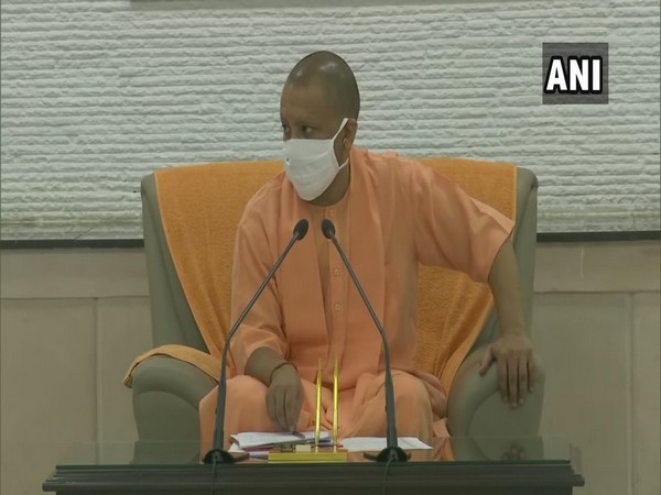 Uttar Pradesh Chief Minister Yogi Adityanath seen wearing a face mask during a review meeting over COVID-19 in Lucknow on Tuesday.
