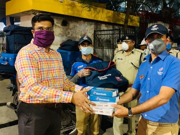 Raipur DIG Arif Shaikh along with Domino's delivery valets (Photo/ANI)