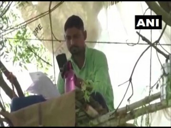 Subrato Pati, a teacher from West Bengal, at his workplace on a tree. [Photo/ANI]