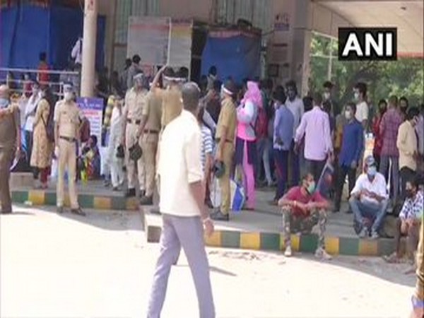 Migrant labourers and others at Bengaluru's Majestic Bus Terminal on Saturday.