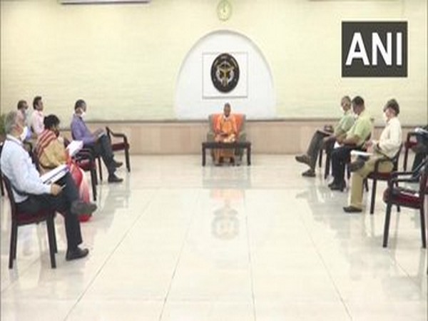  Uttar Pradesh Chief Minister Yogi Adityanath holds a meeting with chairpersons of 11 committees of the state to combat  coronavirus [Photo/ANI]