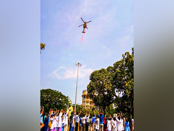 Indian Air Force helicopter showered flower petals over Trivandrum Medical College Hospital on Sunday. (Image credit: Defence PRO)