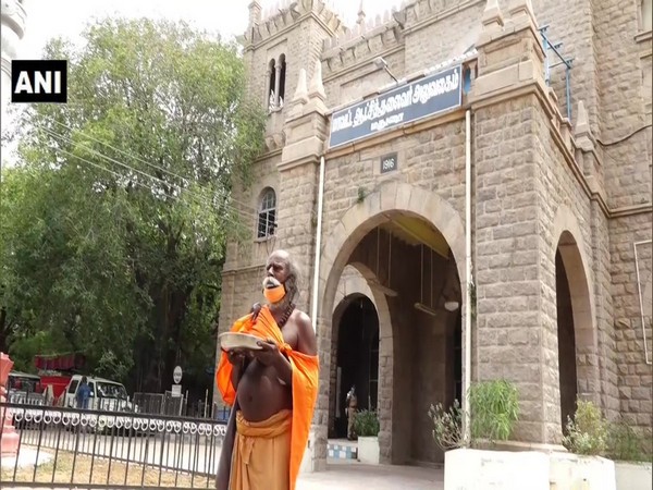 Alms seeker Poolpandiyan outside the district collector's office in Madurai