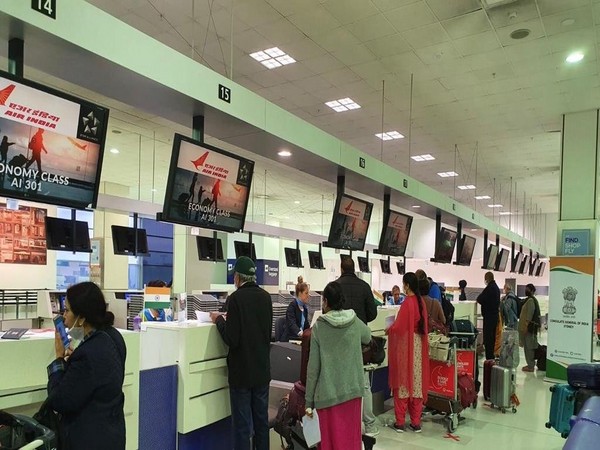 Passengers queue at Sydney airport to board the Air India special flight on Thursday.