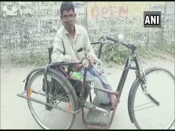 Raju sitting in his tricycle in Pathankot.