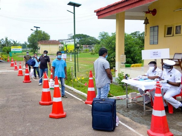 The naval personnel at Southern Naval CCC doing necessary formalities for the Indians who completed their quarantine period. Photo/ANI
