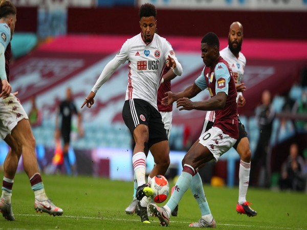 Sheffield United players with Aston Villa player during their Premier League clash on Wednesday. (Photo/ Sheffield United Twitter) 