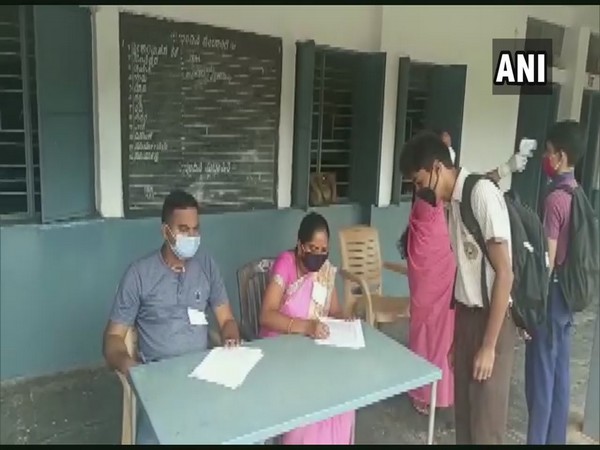 Students got their temperatures checked before they entered the exam hall in Hubli, Karnataka.