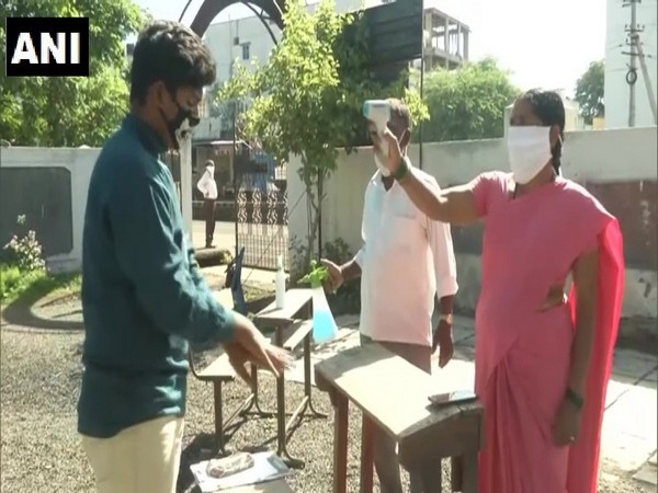 Students got their temperatures checked before they entered the exam hall in Kalburgi, Karnataka.