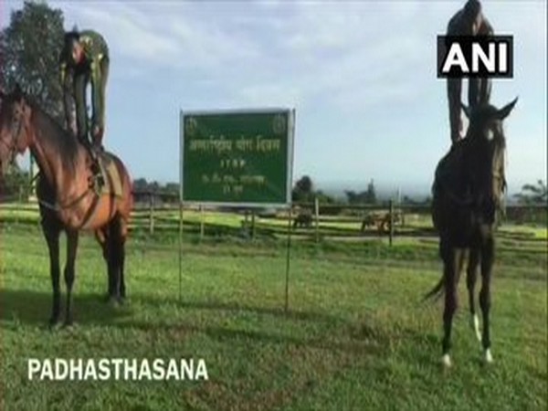 ITBP personnel of Animal Training School, Lohitpur perform yoga with horses on International Yoga Day. [Photo/ANI]