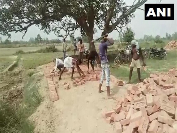 Migrant workers return to Barabanki, Uttar Pradesh to resume work under MGNREGA.