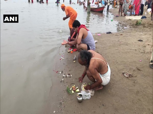 Devotees at Sangam Ghat on the occasion of Guru Purnima.
