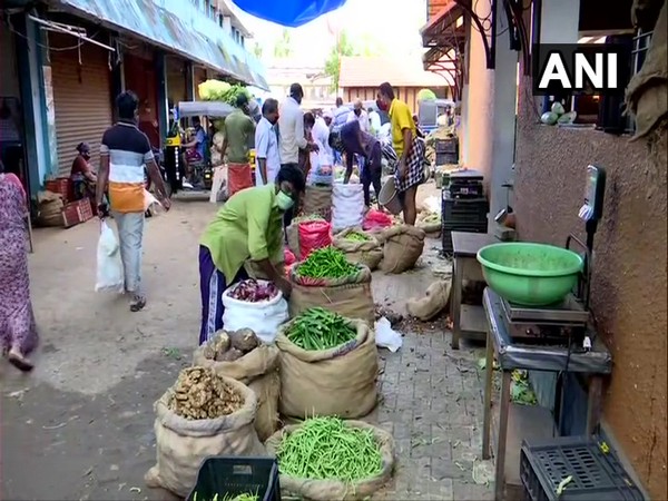 Residents venture out of their homes to buy vegetables in Thiruvananthapuram on Wednesday.
