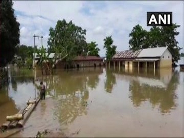 Normal life disrupted in Nagaon district due to floods caused by continuous rainfall. [Photo/ANI]