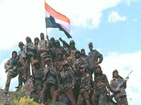 Soldiers holding flag (Image courtesy: Twitter)