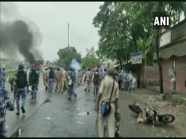 Clash breaks out between security personnel and locals, during the protest against an alleged gangrape and murder of a girl in Kalagachh in Uttar Dinajpur on Sunday (Photo/ANI)