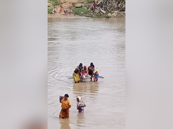 A pregnant woman was carried in a utensil in absence of road/bridge in Chhattisgarh's Bijapur (Photo/ANI)
