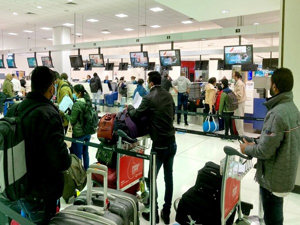 Indian nationals at Sydney Airport preparing to board the flight to India. (Photo credit: India in Sydney Twitter)