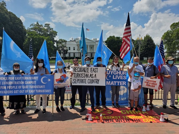 East Turkistan National Awakening Movement activists demanding end of US deal with China. Photo/ANI