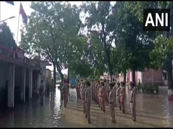 Police personnel celebrate Independence Day amid flooding in Bahraich. [Photo/ANI]