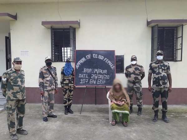BSF personnel with young Bangladesh woman who was rescued from the clutches of human traffickers. Photo/ANI