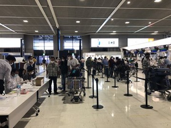 Passengers at Japan's Narita Airport getting ready to board the special Air India flight. (Photo credit: Indian Embassy twitter)