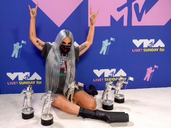 Musician Lady Gaga posing with her VMAs (Image Source: MTV VMA's Twitter)