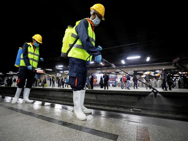 Members of medical team spray disinfectant amid concerns over the coronavirus outbreak in Cairo on Sunday.