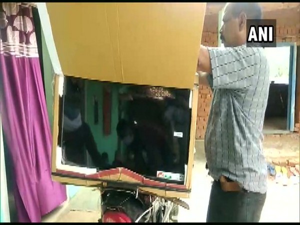 Ashok Lodhi with TV strapped on his bike (Photo/ANI) 