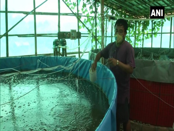 Longjam Boss Meitei, a fish farmer in Manipur's Imphal West shows a Biofloc tank. (Photo/ANI)