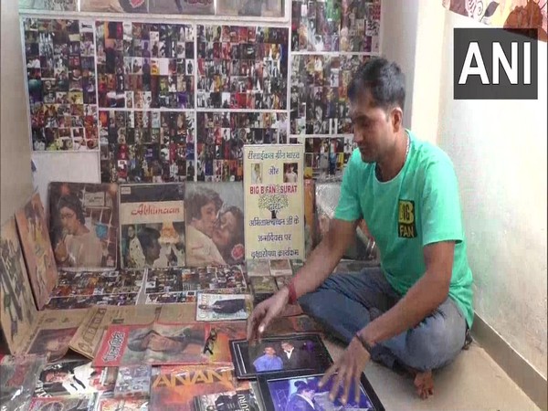 Divyesh Kumar with his collection of pictures. (Photo/ANI)