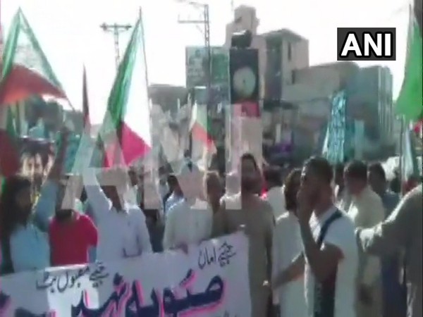 People from Gilgit Baltistan carried out demonstrations in Muzaffarabad (PoK), Karachi and Hunza against Pak govt's attempt to alter the status of Gilgit Baltistan by making it a province. (Photo/ANI)