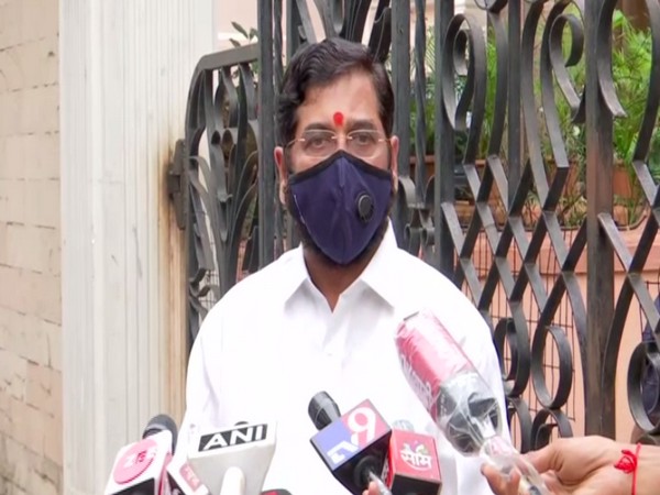 Maharashtra Cabinet Minister Eknath Shinde talking to reporters on Sunday. Photo/ANI