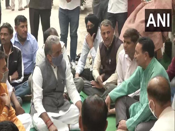 Faridabad MP Krishan Pal Gurjar with the family of the victim. (Photo/ANI)