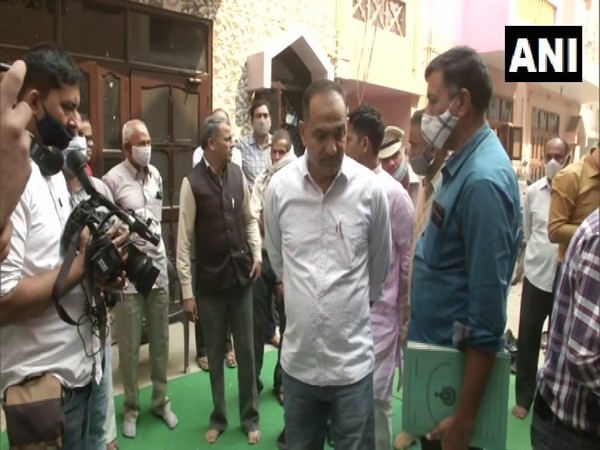 SIT officials at the Ballabgarh murder victim's residence. (Photo/ANI)